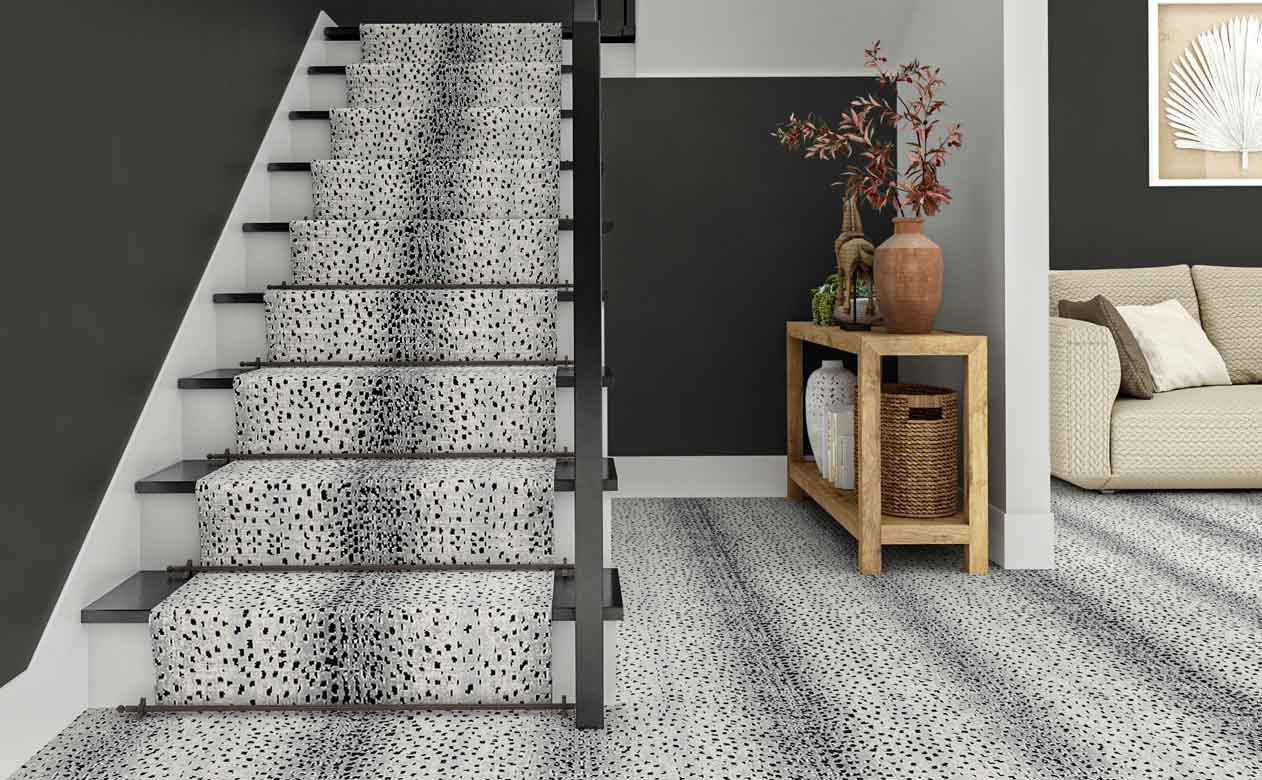 gray animal print carpet on staircase in main foyer